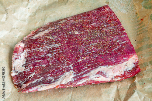 Принти на полотні Raw Flank Steak on Butcher Paper: An uncooked London broil fillet on brown paper
