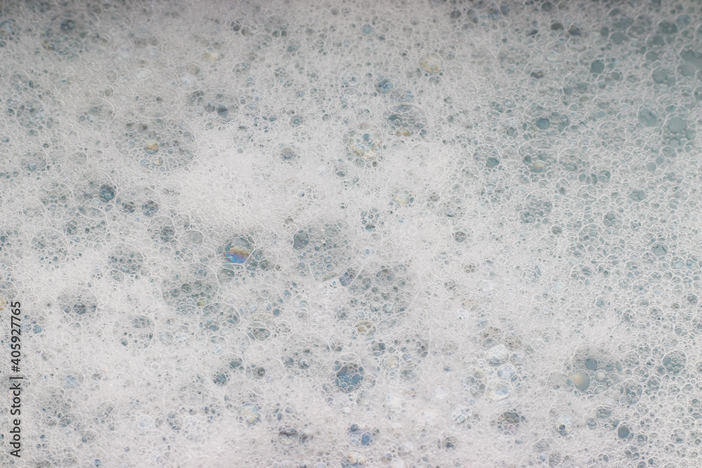 Obraz premium White foam with soap bubbles, selective focus