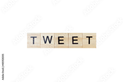 TWEET . English word on white isolated background composed from letters on wooden cubes. Learning english concept.