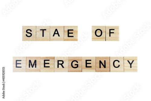 stae of emergency. English word on white isolated background composed from letters on wooden cubes. Learning english concept.