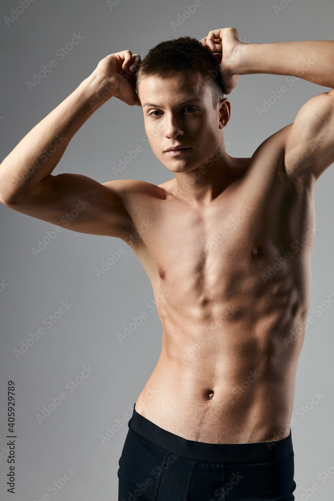 young athlete with pumped up cubes on his stomach bodybuilder fitness torso young athlete with pumped up cubes on his stomach bodybuilder fitness torso
