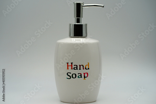 Hand soap in a white ceramic push pump bottle