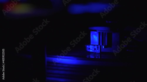 Blue ligh disc spinning in turntable