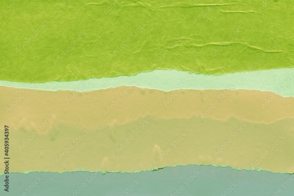 Green torn paper collage close-up. Texture made from various paper and cardboard parts. Damaged old paper background. Vintage blank wallpaper. Material design backdrop. Green torn paper collage close-up. Texture made from various paper and cardboard parts. Damaged old paper background. Vintage blank wallpaper. Material design backdrop.