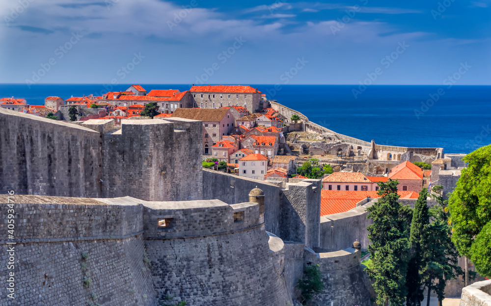 A view over old outer walls and houses inside old town of Dubrovnik, Croatia.