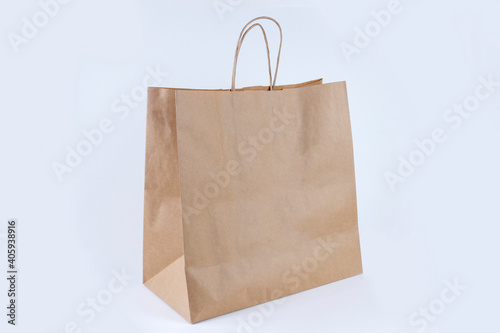 Recycled paper shopping bag on white background