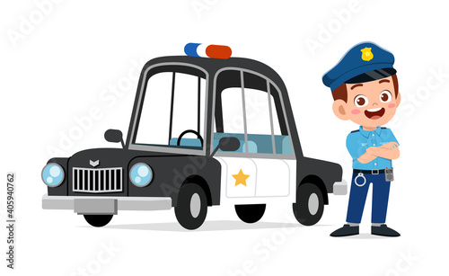 happy cute little kid boy wearing police uniform and stand beside car
