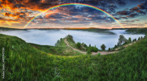 Beautiful landscape with a rainbow in the sky