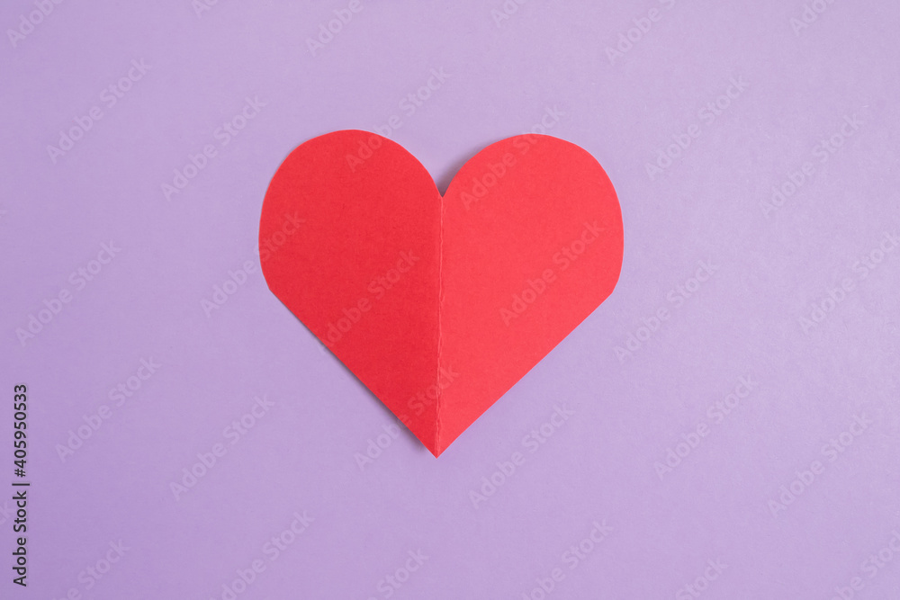 Paper heart on a purple pastel background. Abstract background with paper cut shapes. Sainte Valentine, mother's day. birthday greeting cards, invitations. Holiday concept.Copy space.