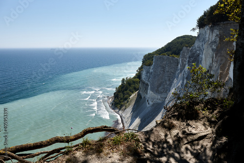 Spectacular cliffs of Mons Klint on Mon Island in Denmark. Top view of the beaches and walking tourists. photo