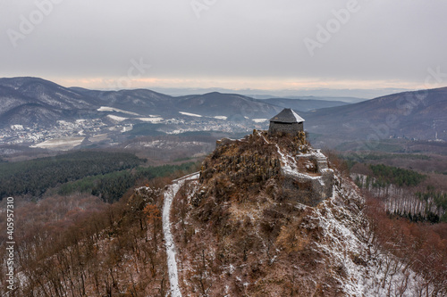 Hungary - Salgo castle covered with snow in winter from drone view photo