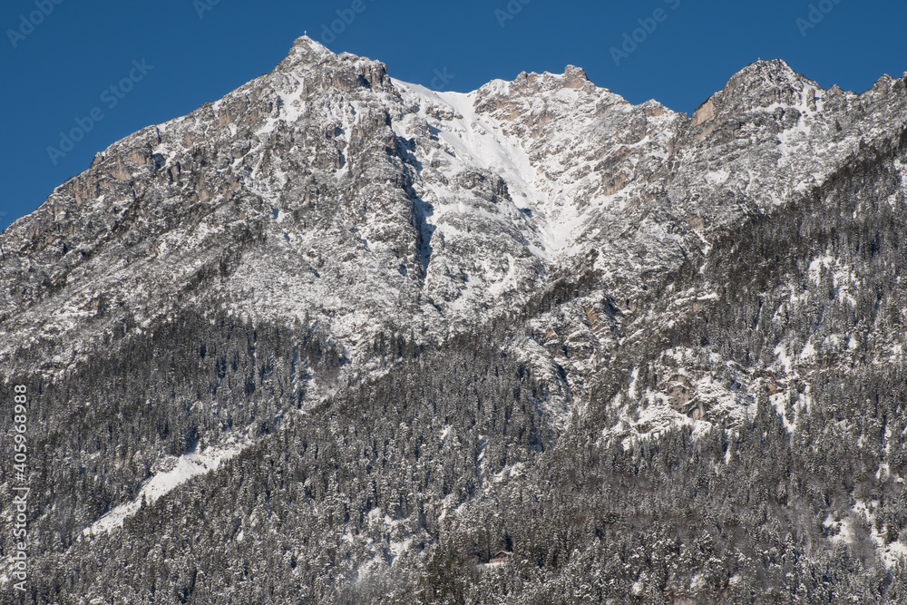 Snow-covered mountainside in the European Alps on a sunny day, seen from Garmisch-Partenkirchen, Germany