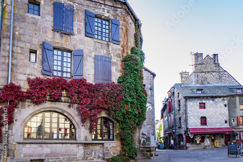 the main square of the small medieval town of Besse en Chandesse in Auvergne, France photo