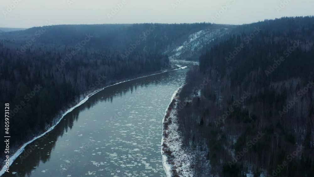 Aerial view of the cold river, rocks and forest in early winter Aerial view of the cold river, rocks and forest in early winter