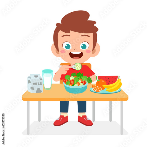 happy cute kid boy eat healthy food
