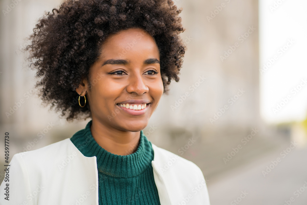 Portrait of afro business woman outdoors on the street. Portrait of afro business woman outdoors on the street.