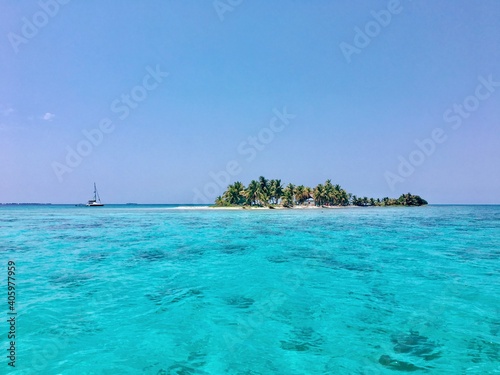 Sailboat anchored off a beautiful Island in Belize off the belize barrier reef