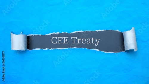 CFE Treaty. Blue torn paper banner with text label. Word in gray hole. photo