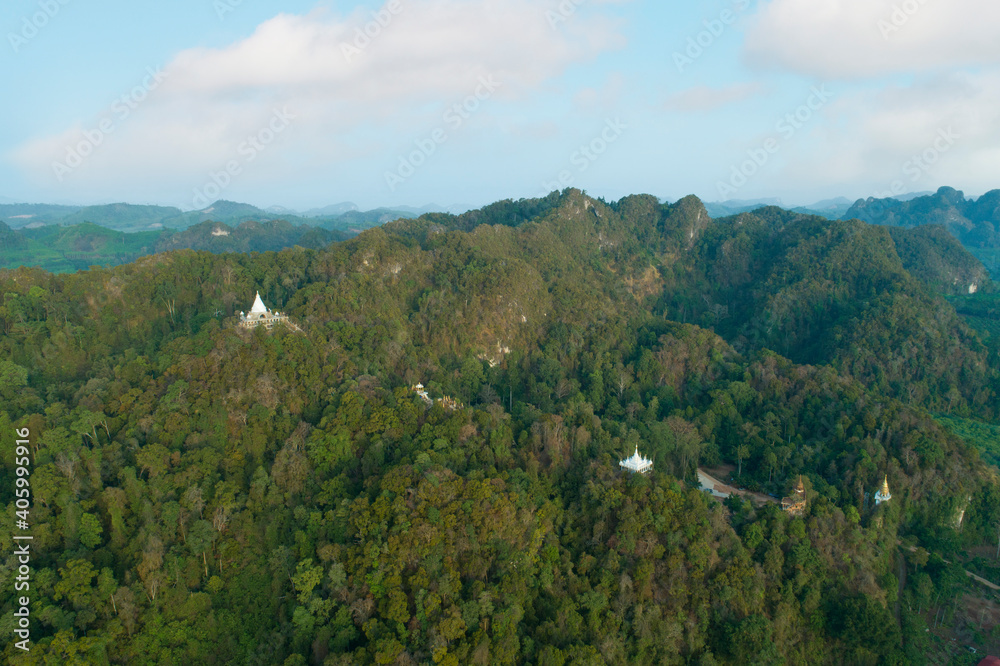 Trees in the forest, aerial view above, a pagoda perched on a mountain,thamma park Ban khao na nai,Surat thani Thailand