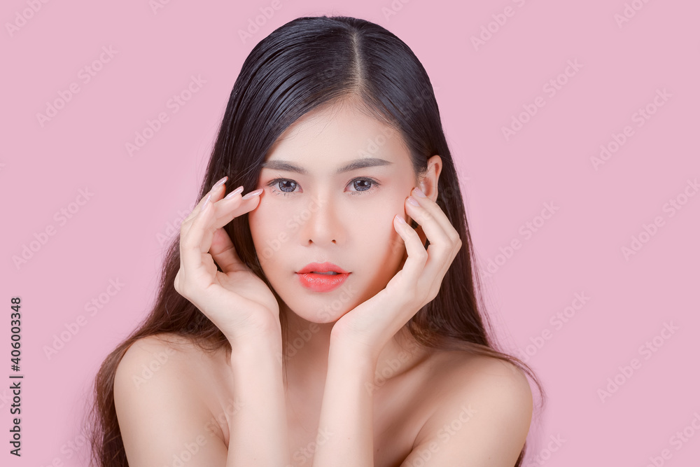 Beauty and healthcare. Portrait of young and beautiful asian woman on pink background Beauty and healthcare. Portrait of young and beautiful asian woman on pink background