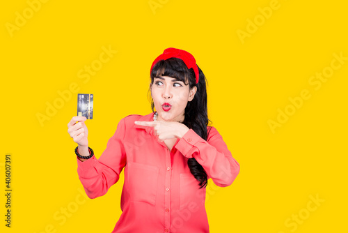 Young smiling Asian woman presenting credit card in hand showing trust and confidence for making payment,Reliable financial company