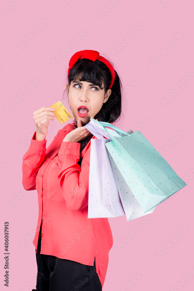 Young smiling Asian woman presenting credit card in hand showing trust and confidence for making payment,Reliable financial company Young smiling Asian woman presenting credit card in hand showing trust and confidence for making payment,Reliable financial company