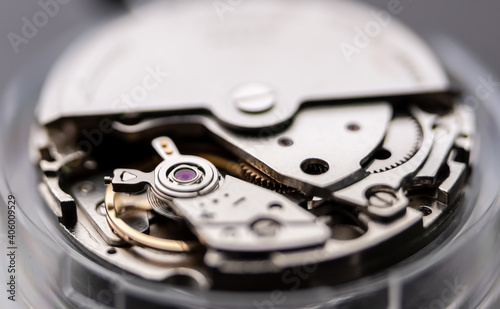 Wallpaper Mural Close up of Automatic winding watch movement waiting for repairing, inside shiny japanese mechanical wristwatch parts on watchmaker table Torontodigital.ca