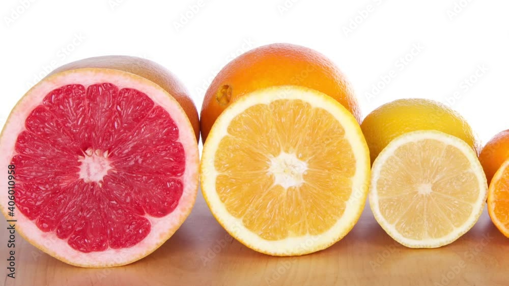 HD video panning across colorful sliced citrus lined up in rows on a ...