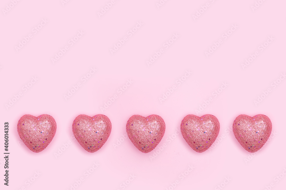 Obraz premium Pink hearts on pink background. Love concept. Valentines day background.