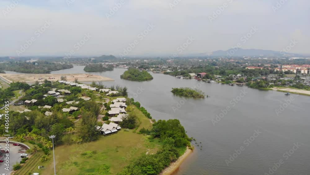 The Sea In Malaysia On A Warm Summer Day Surrounded By Greenery And Beautiful Houses - Pan Left To Right The Sea In Malaysia On A Warm Summer Day Surrounded By Greenery And Beautiful Houses - Pan Left To Right