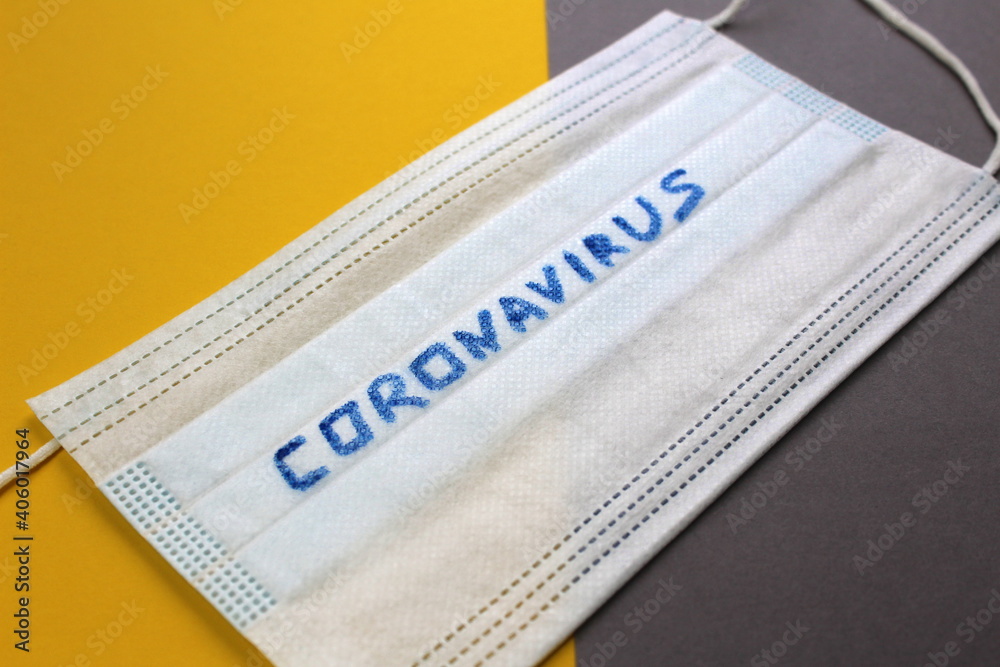 Obraz premium Coronavirus is written on the medical mask.