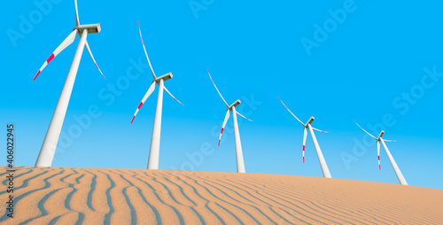 Renewable energy with windmills and solar panels in dessert