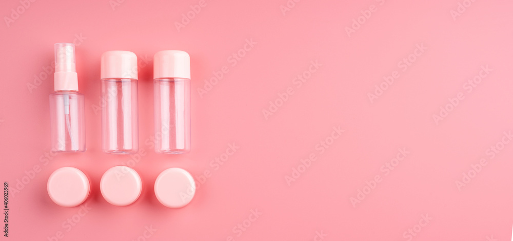 Empty plastic bottles and tubes for cosmetic on pastel pink background with copy space Empty plastic bottles and tubes for cosmetic on pastel pink background with copy space