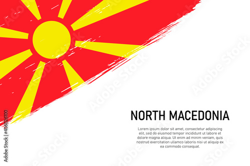 Grunge styled brush stroke background with flag of North Macedonia