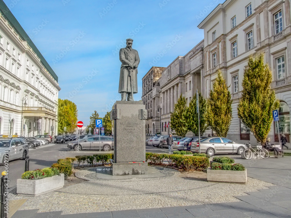 Warsaw, Poland - October 9, 2018: Jozef Pilsudski Monument at Tokarzewski-Karaszewicz Street in Warsaw. Tall, bronze and granite statue of the military leader, Marshal of Poland on an autumn sunny day