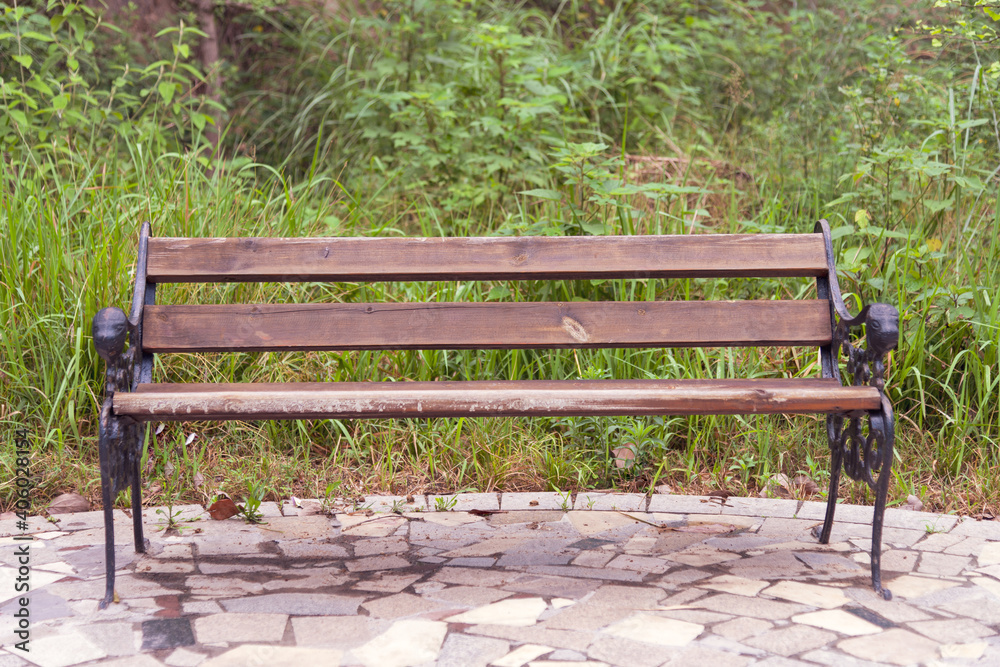 Wooden chairs in the park in spring