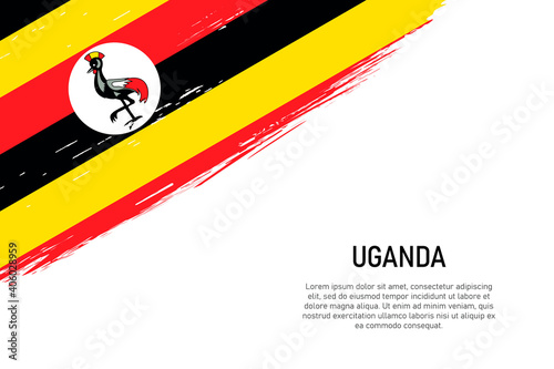 Grunge styled brush stroke background with flag of Uganda