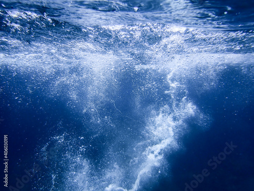 sea bubbles . Blue sea waves from underwater with bubbles. Light rays shining through. Great for backgrounds. water bubble . Mediterranean sea bubble.