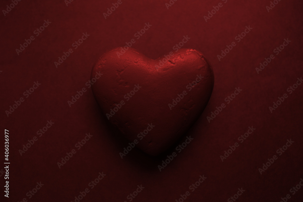 Valentines day background. Black textured heart, isolated on black.