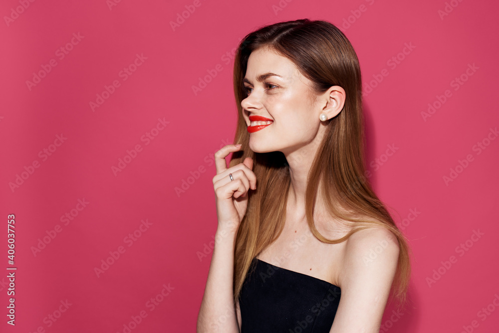 Woman in black dress red lips glamor pink background glamor Woman in black dress red lips glamor pink background glamor
