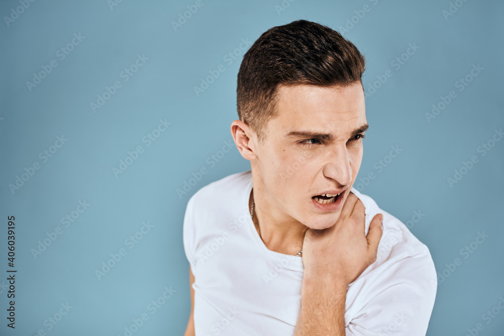 Man gestures with his hands emotions white t-shirt expression blue background Man gestures with his hands emotions white t-shirt expression blue background