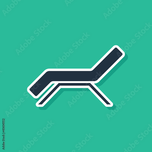 Blue Sunbed icon isolated on green background. Sun lounger. Vector.