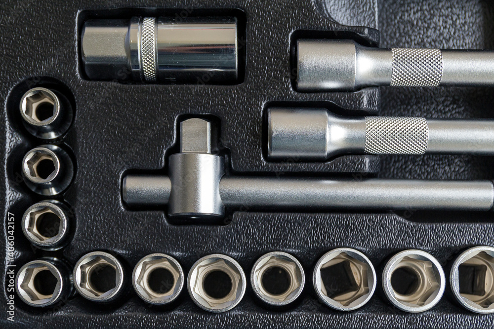 Set of tools closeup - wrench heads, nozzles the screwdriver in case. Professional instrument. Selective focus. Set of tools closeup - wrench heads, nozzles the screwdriver in case. Professional instrument. Selective focus.