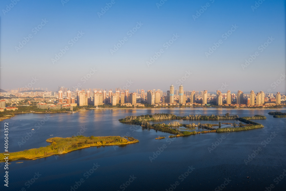 Aerial view of city skyline and natural park with lakes in Jimei District in Xiamen