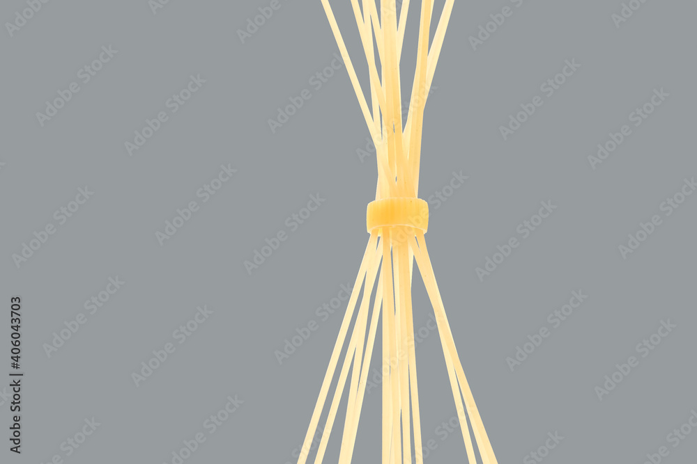 italian pasta spaghetti on a gray background. flour products and food in cooking