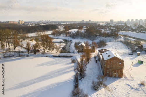 Abandoned old buildings in the Winter Loshitsky Park. Minsk, Belarus photo