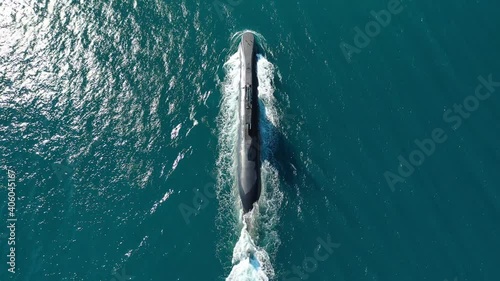 Aerial drone video of latest technology armed diesel powered submarine cruising half submerged