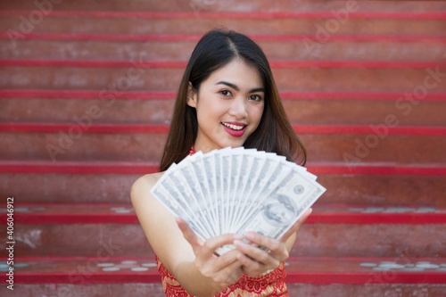 Woman holding money Ang Pao Chinese Happy new year