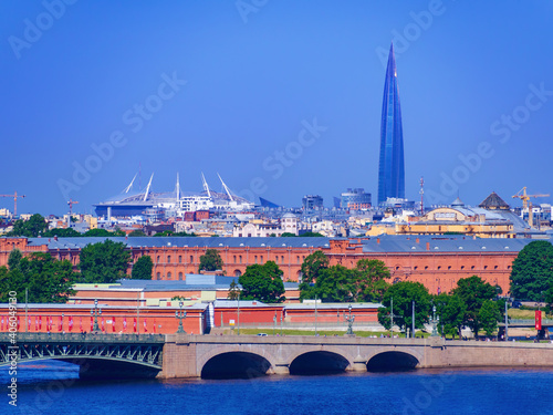 RUSSIA, SAINT PETERSBURG - 06.09.20: Roofs of Saint Petersburg, Russia at sunset, city skyline. Gazprom Arena Zenit, Lakhta Center, Cable-stayed bridge photo