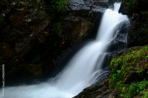 soft clear splashing waterfall in the nature